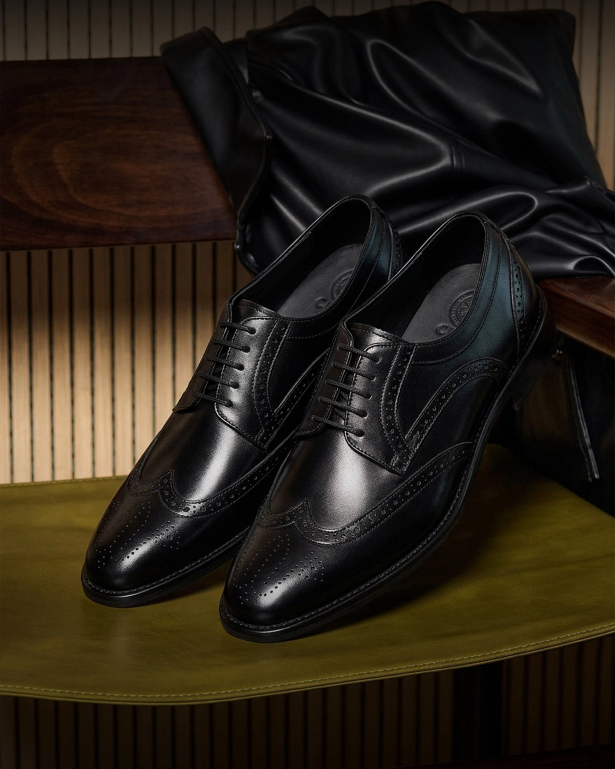 The Black Regent black leather men’s dress shoes styled for a formal wedding