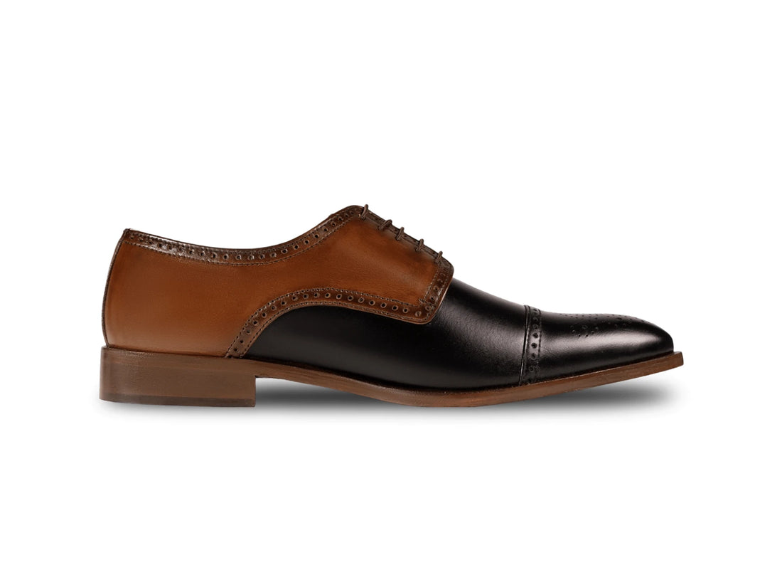 The Kensington Two-Tone men’s cognac and black cap-toe oxford dress shoe side profile