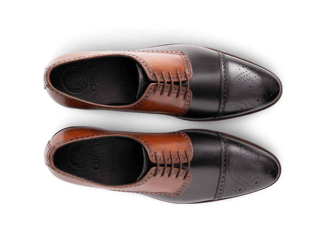 The Kensington Two-Tone men’s cognac and black cap-toe oxford dress shoes top view