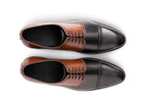 The Kensington Two-Tone men’s cognac and black cap-toe oxford dress shoes top view