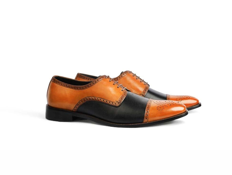 The Valoric Viceroy men’s two-tone cap-toe oxford dress shoes side view cognac and black