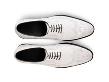 The White Sovereign men’s white wingtip brogue dress shoes top view